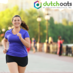 Woman running along the waterfront with DUTCH Oats logo in the corner